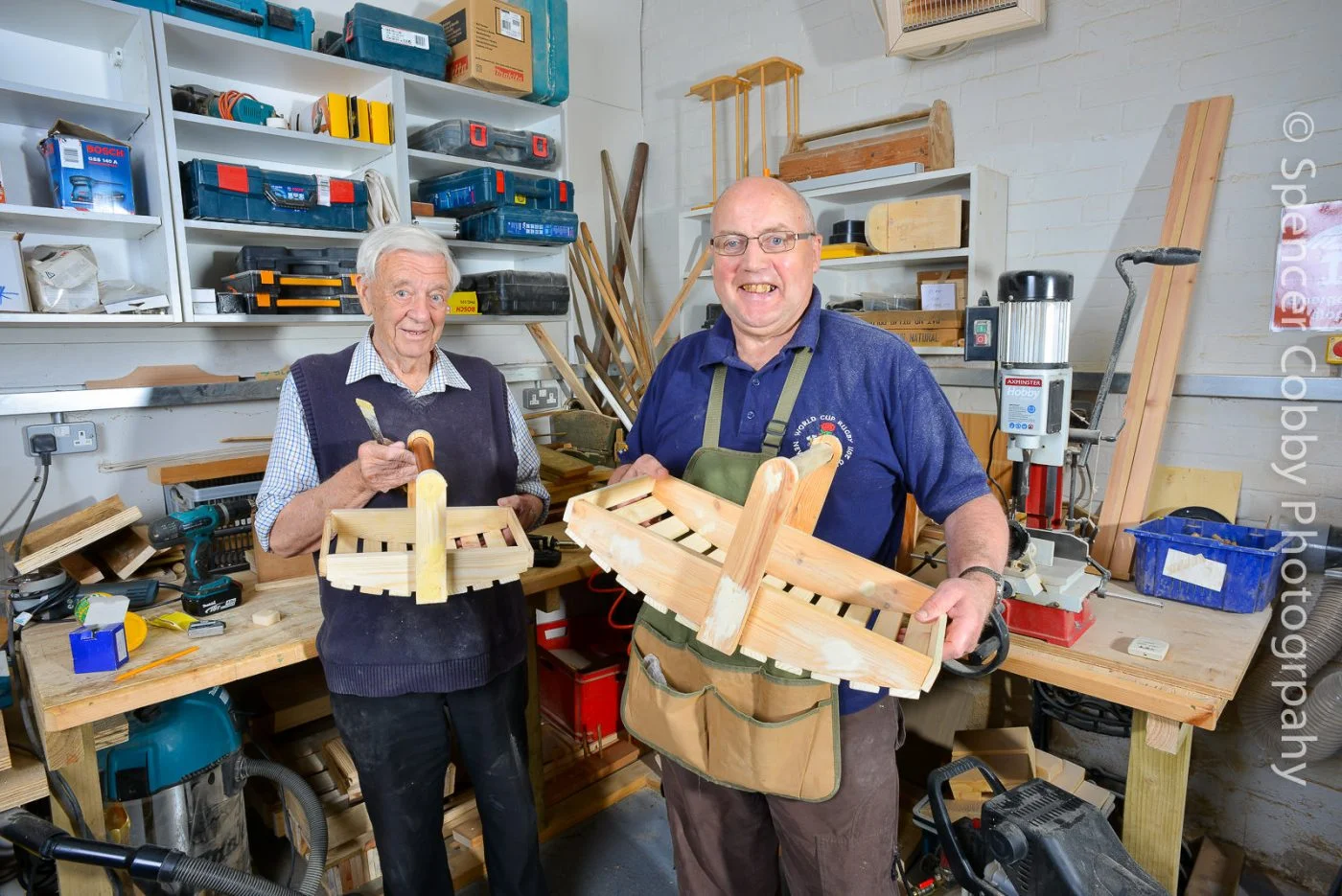 Men in Sheds - Age Uk Exeter - Two men showing their newly made garden baskets-2